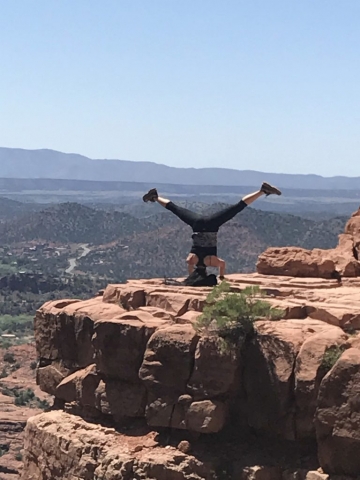 Me doing a Straddle Headstand on a rock ledge at the top of Cathedral Rock. Sedona, AZ - 2017.04.28