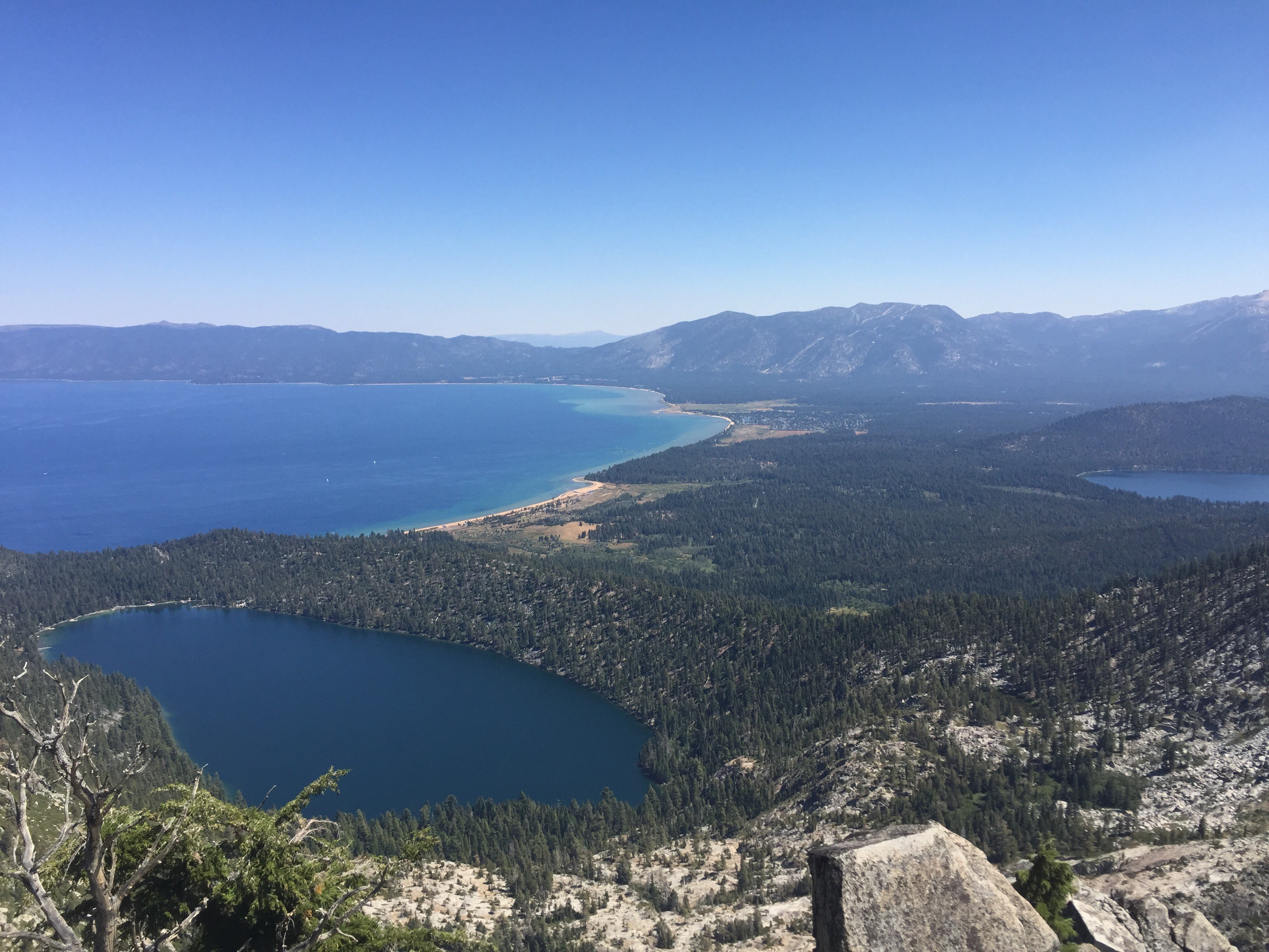 Lake Tahoe in the upper-middle left side, Cascade Lake on the lower left, and northern edge of Fallen Leaf Lake on the far right. You can also see Lake Tahoe Blvd and the casinos at stateline if the air is clear. 8/25/2016